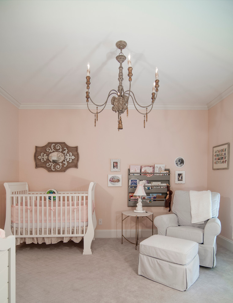 Medium sized classic nursery for girls in Charlotte with pink walls and carpet.