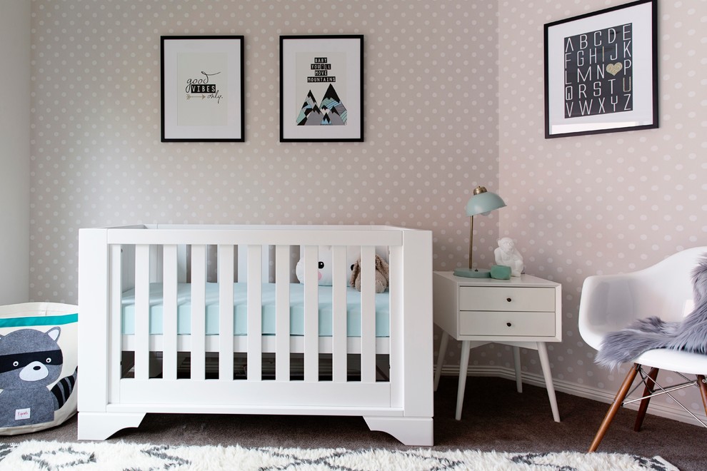 Example of a small trendy gender-neutral carpeted nursery design in Melbourne with beige walls