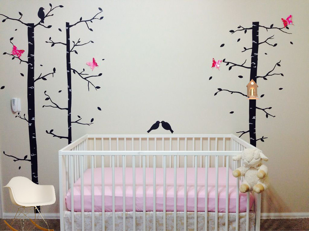 Nursery - small transitional girl nursery idea in Denver with beige walls