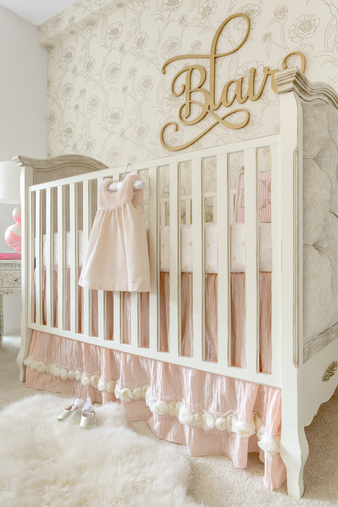 This is an example of a medium sized traditional nursery for girls in New York with carpet.