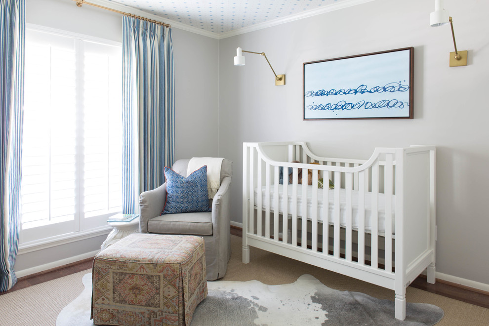 Design ideas for a medium sized beach style nursery for boys in Houston with grey walls and dark hardwood flooring.