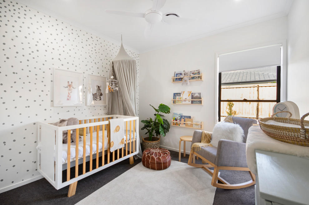 Exemple d'une chambre de bébé tendance.