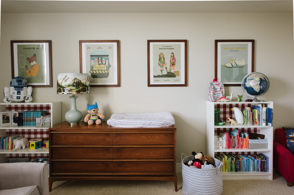 This is an example of a medium sized eclectic nursery for boys in Other with beige walls.