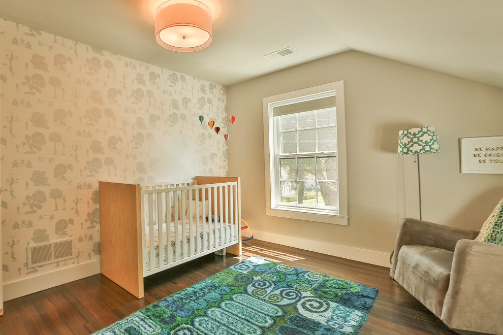 Photo of a medium sized contemporary nursery in Boston with multi-coloured walls and dark hardwood flooring.