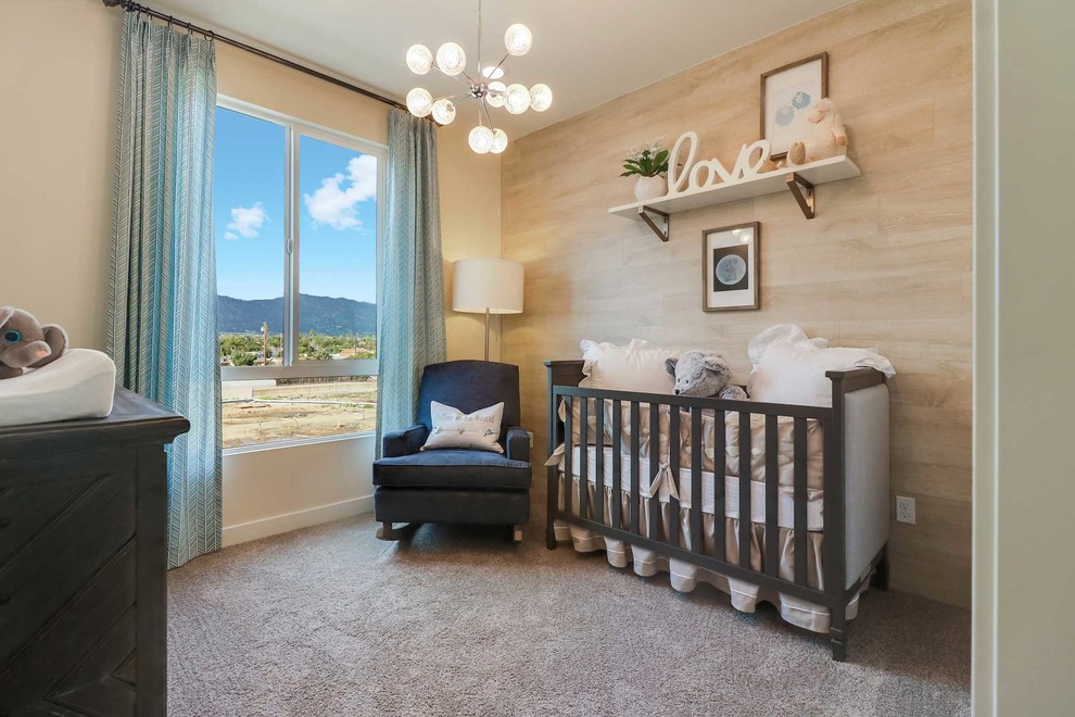 На фото: нейтральная комната для малыша в стиле неоклассика (современная классика) с желтыми стенами, ковровым покрытием и серым полом