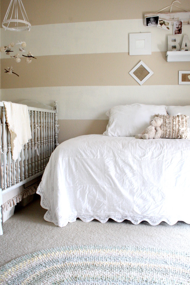 Nursery - traditional gender-neutral carpeted nursery idea in Dallas with beige walls