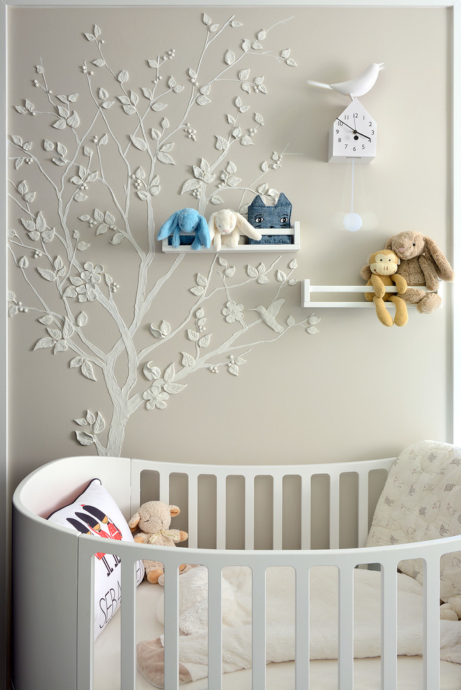 Design ideas for a medium sized modern gender neutral nursery in Toronto with beige walls and dark hardwood flooring.