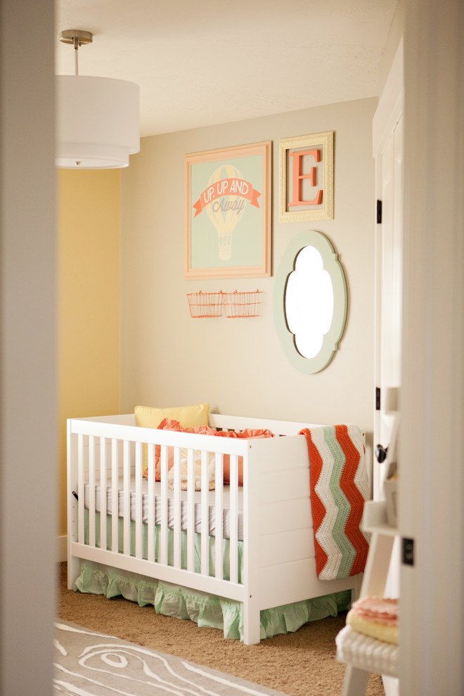 Inspiration for a mid-sized eclectic girl carpeted nursery remodel in Salt Lake City with beige walls