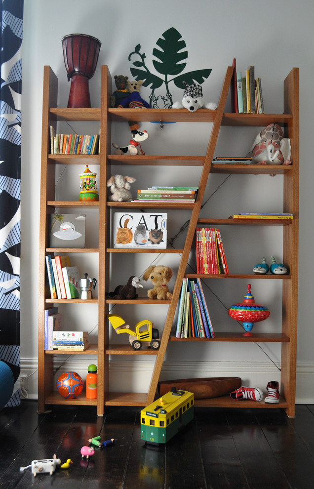Design ideas for a small retro nursery for boys in Melbourne with white walls and dark hardwood flooring.