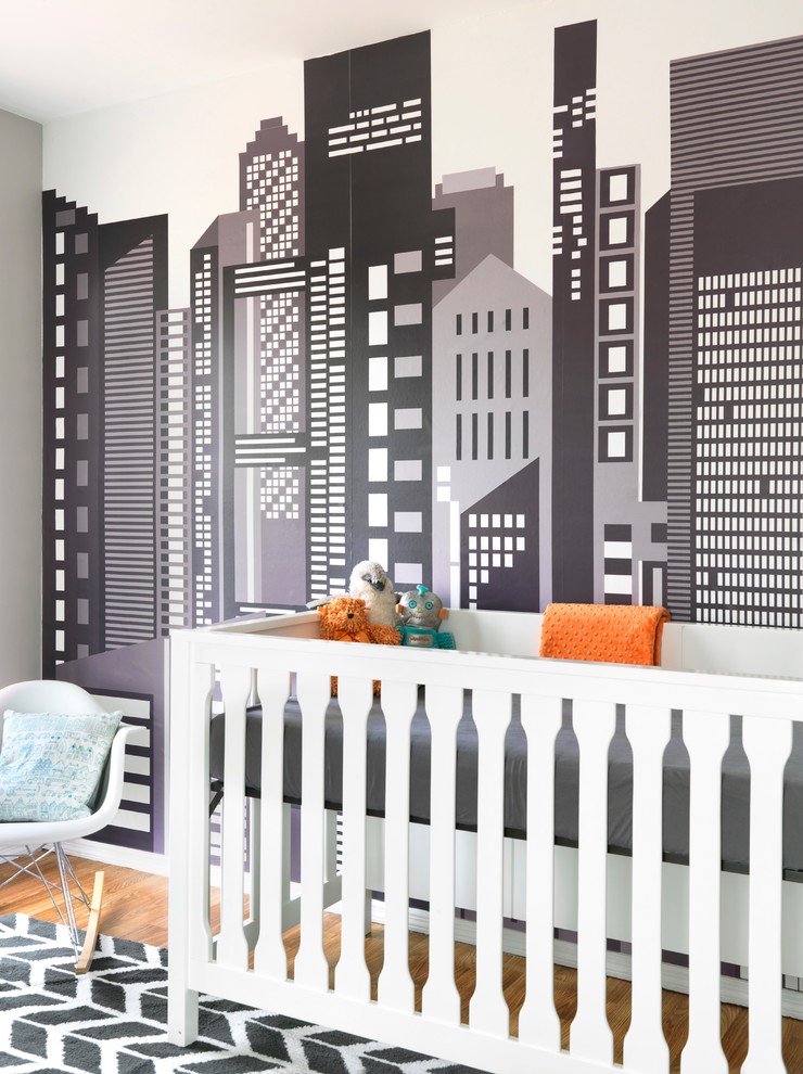 Imagen de habitación de bebé neutra nórdica con paredes multicolor
