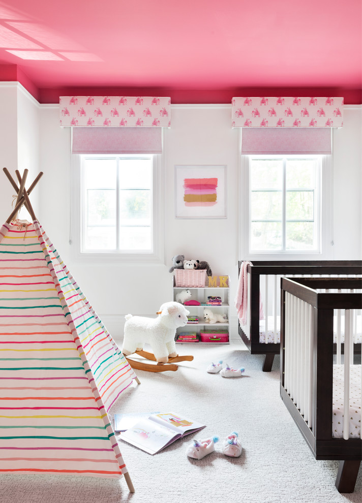 Medium sized scandi nursery for girls in New York with white walls, carpet and white floors.