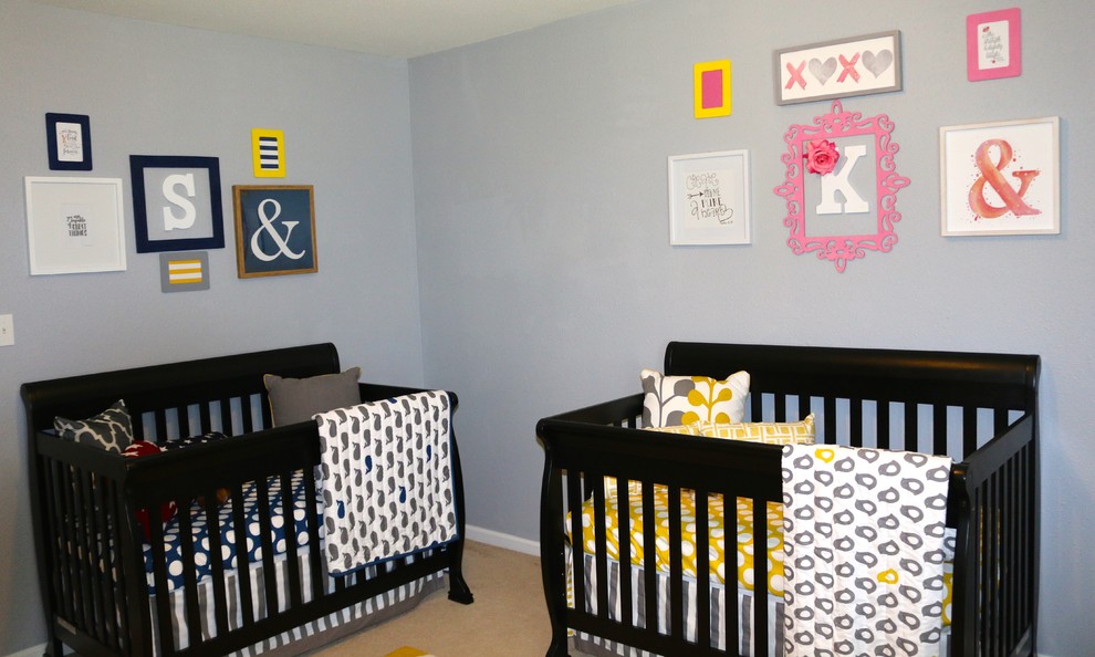 This is an example of a contemporary nursery in Charlotte with grey walls.