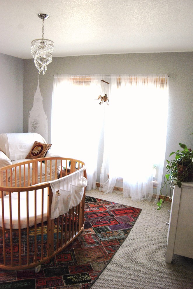 Design ideas for an eclectic gender neutral nursery in Other with grey walls and carpet.