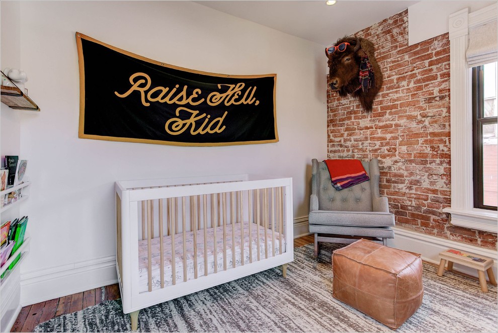 Inspiration for a traditional gender neutral nursery in Denver with white walls and dark hardwood flooring.