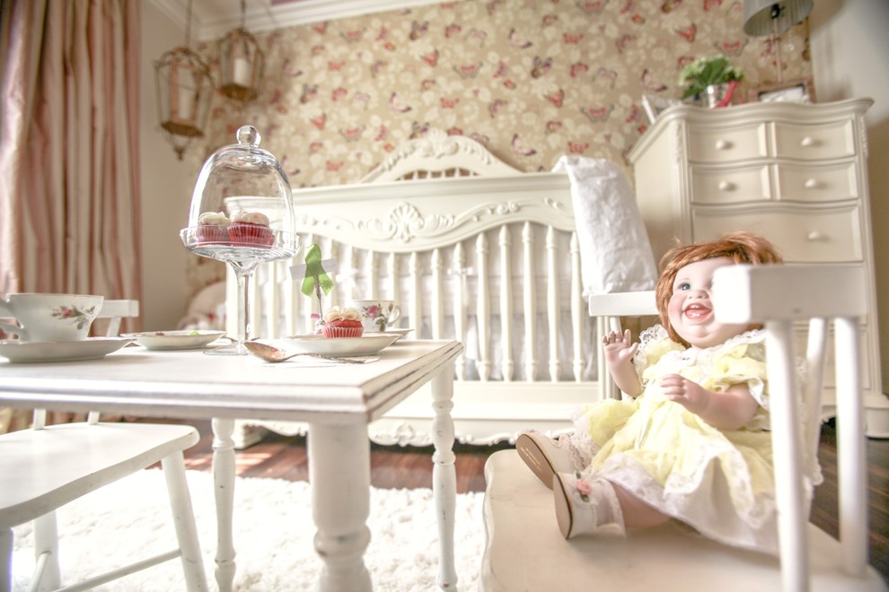 Inspiration for a medium sized traditional nursery for girls in Las Vegas with dark hardwood flooring and white walls.