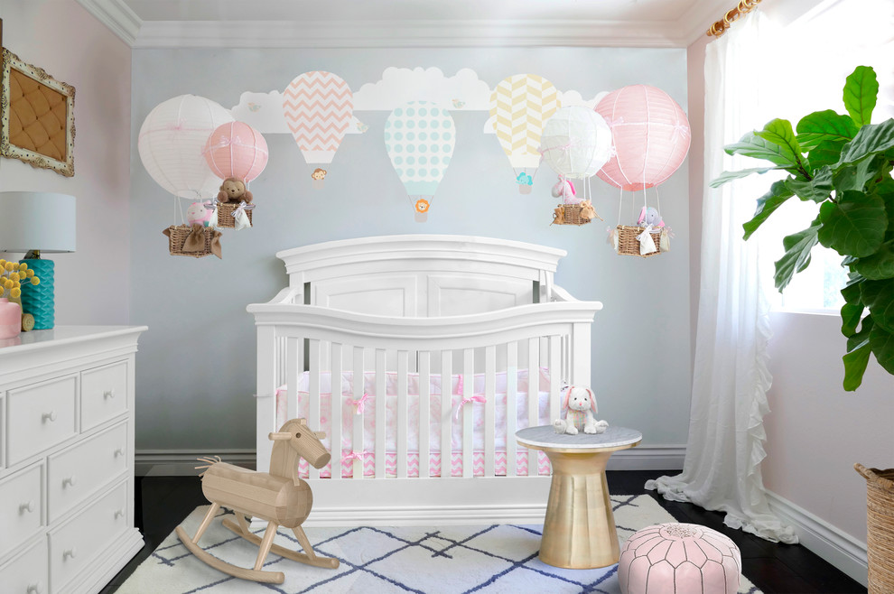 Nursery - mid-sized transitional girl nursery idea in Orange County with pink walls