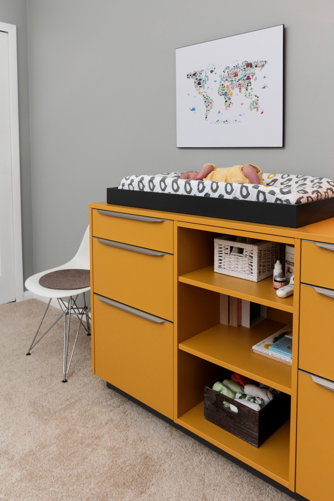 This is an example of a small scandinavian gender neutral nursery in Miami with grey walls, carpet and beige floors.