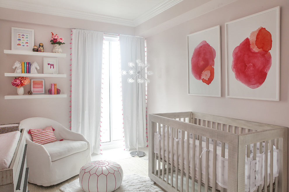 Inspiration for a classic nursery in New York with pink walls.