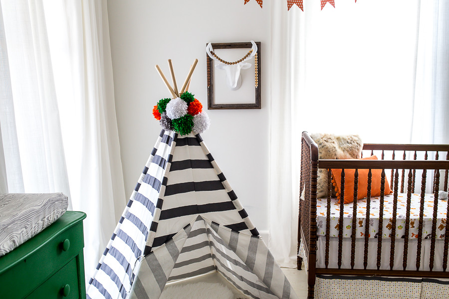 Medium sized eclectic gender neutral nursery in Atlanta with white walls and painted wood flooring.