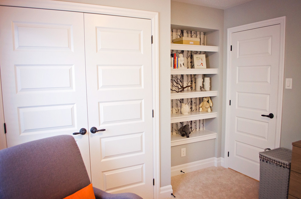 Example of a small mountain style gender-neutral carpeted nursery design in Ottawa with gray walls