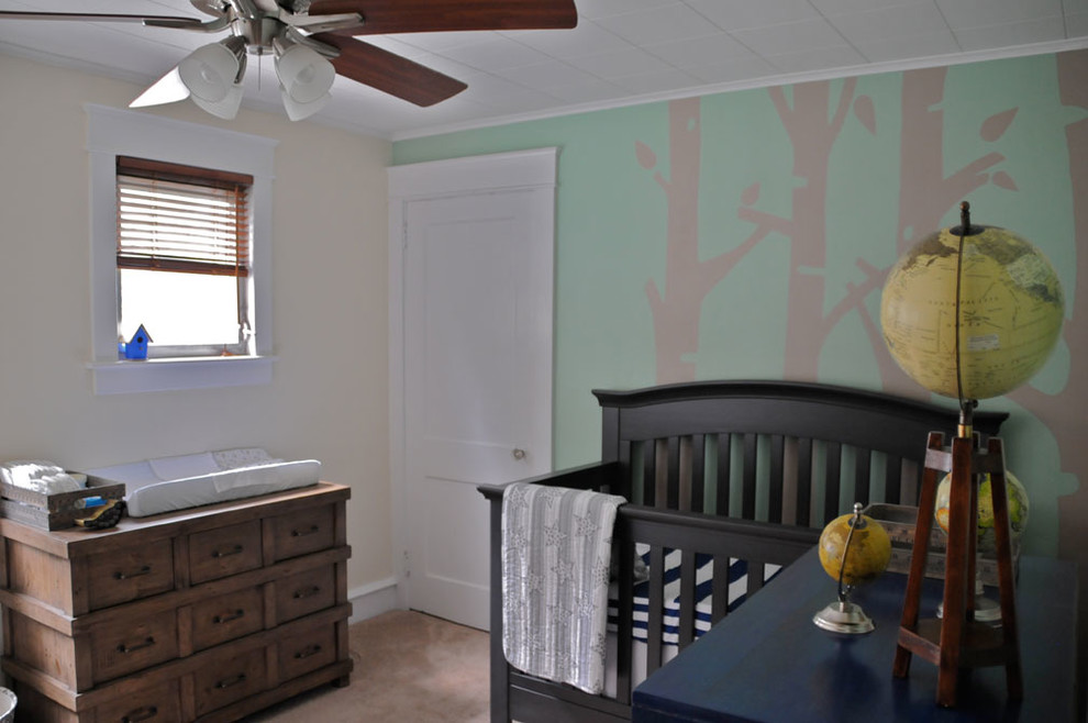 Medium sized traditional nursery for boys in Philadelphia with green walls and carpet.