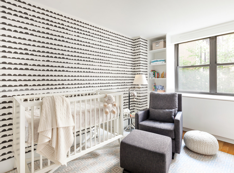 Design ideas for a contemporary gender neutral nursery in Seattle with multi-coloured walls and medium hardwood flooring.