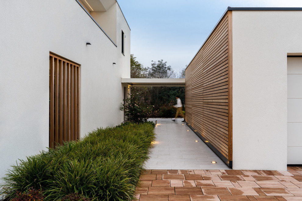 Idées déco pour une terrasse moderne de taille moyenne avec une dalle de béton.