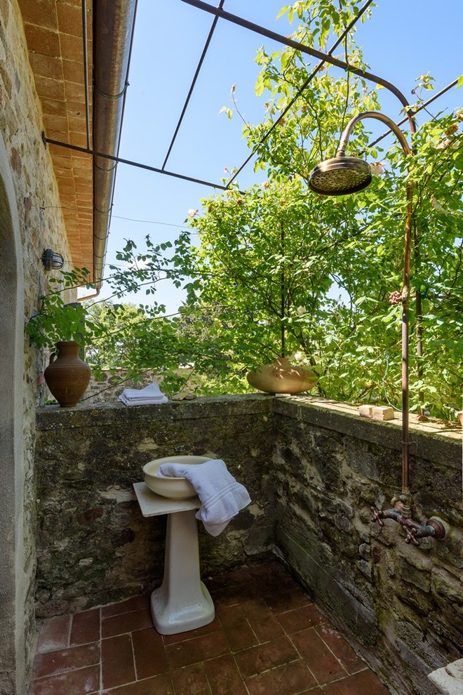 Inspiration for a farmhouse outdoor patio shower remodel in Florence