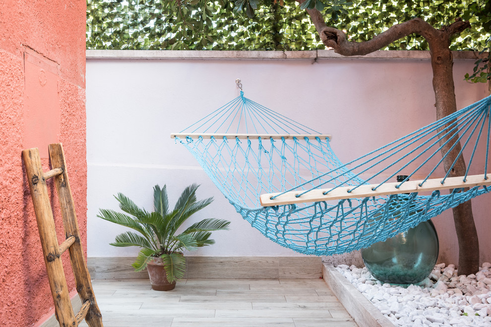Mid-sized beach style front yard patio photo in Rome