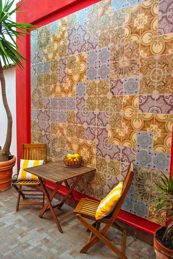 Inspiration for a mid-sized mediterranean side yard patio remodel in Cagliari