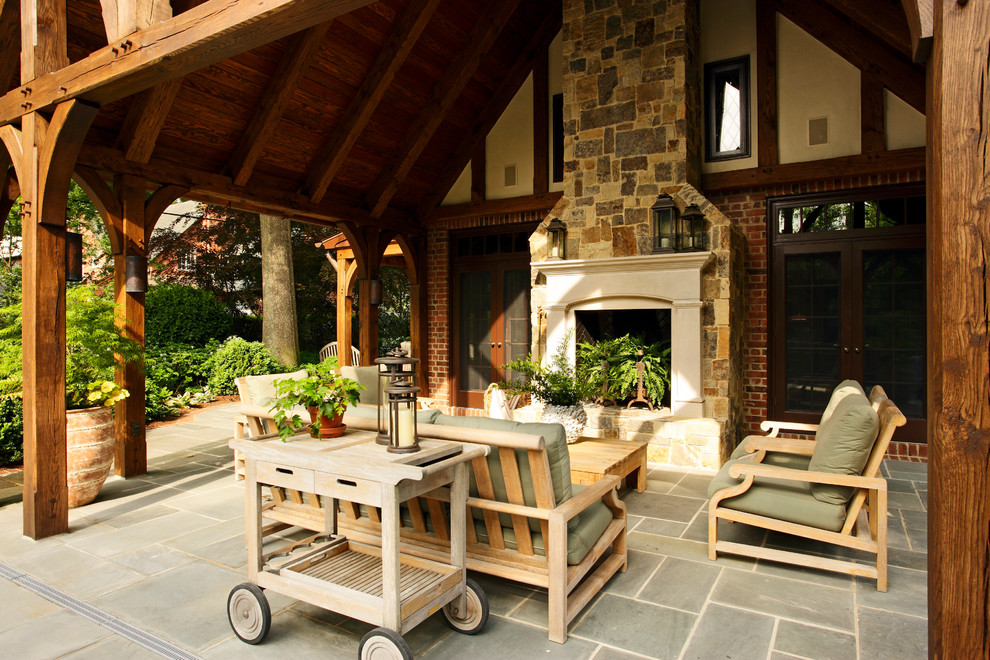 Inspiration for a timeless patio remodel in Richmond with a fire pit and a roof extension