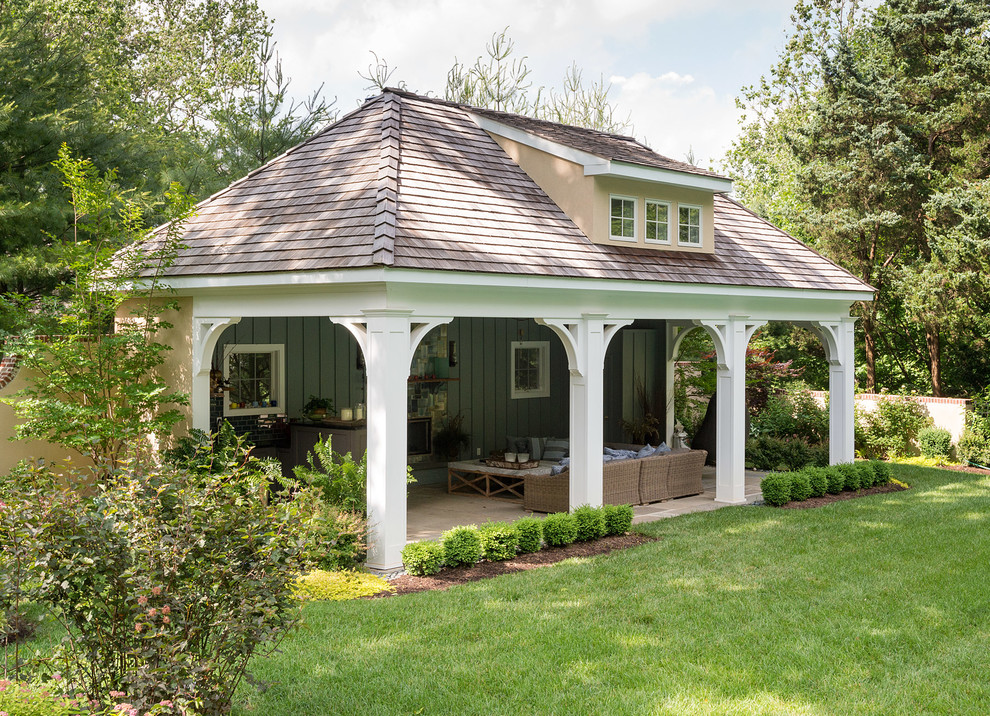 Inspiration for a traditional patio in Philadelphia with a roof extension.