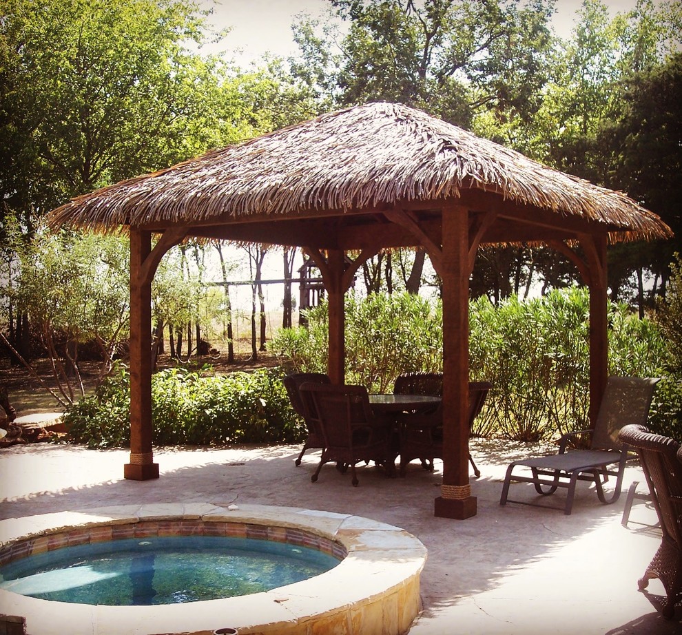 Design ideas for a large nautical back patio in Dallas with concrete slabs and a gazebo.
