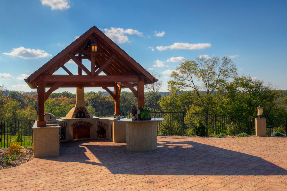Inspiration for a large transitional backyard stone patio kitchen remodel in Boston with a gazebo