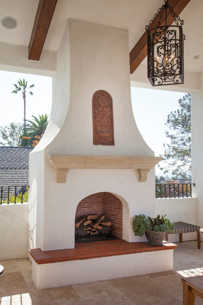 Inspiration for a medium sized mediterranean courtyard patio in San Diego with a fire feature, tiled flooring and a pergola.