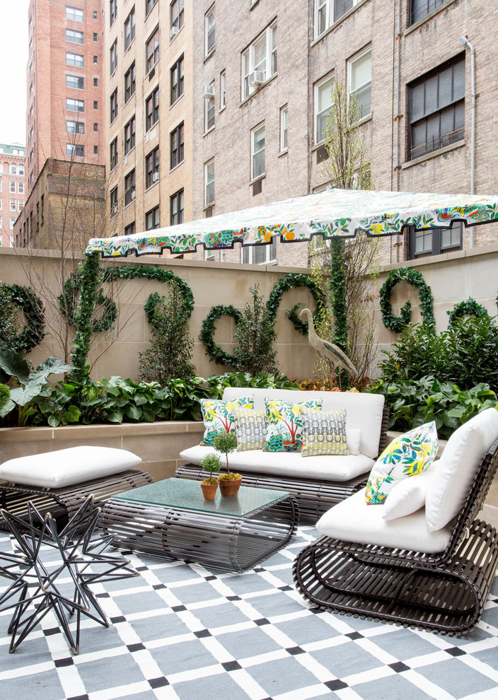 Example of an eclectic patio design in New York