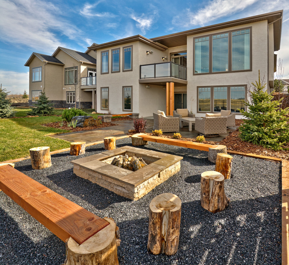 Patio - mid-sized contemporary backyard gravel patio idea in Other with a fire pit and no cover