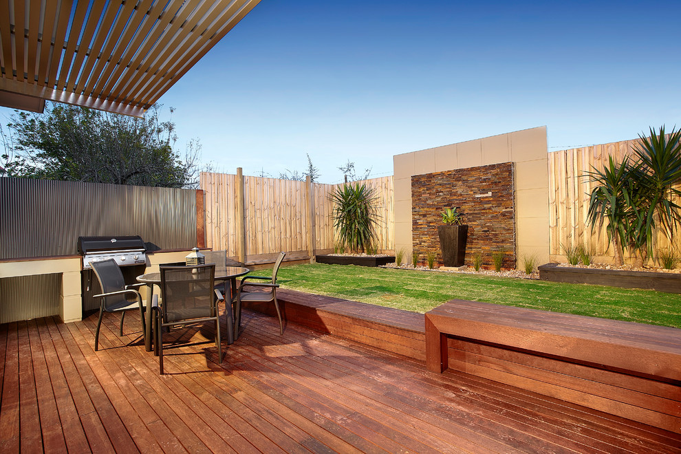 This is an example of a contemporary patio in Melbourne with decking and a bbq area.