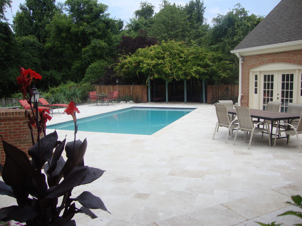 Contemporary patio in DC Metro with natural stone paving.