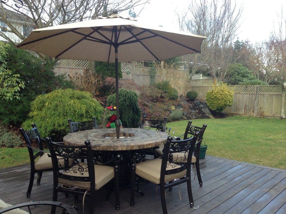 patio set with fire pit and umbrella