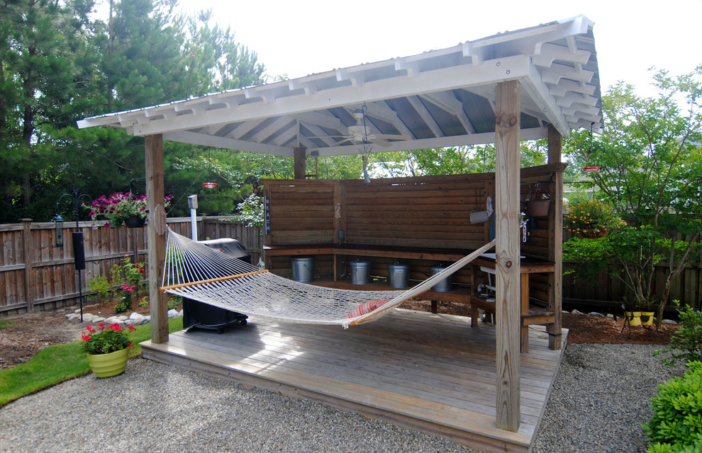 Inspiration for a large world-inspired back patio in Other with an outdoor shower, decking and a pergola.