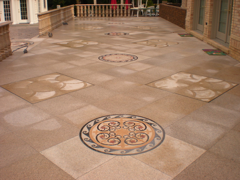 Inspiration for a huge timeless backyard concrete paver patio fountain remodel in New York with a pergola
