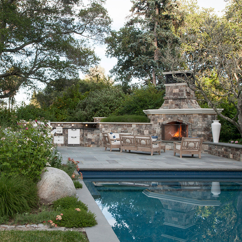 Inspiration for a large timeless backyard stone patio remodel in San Francisco with a fire pit and no cover