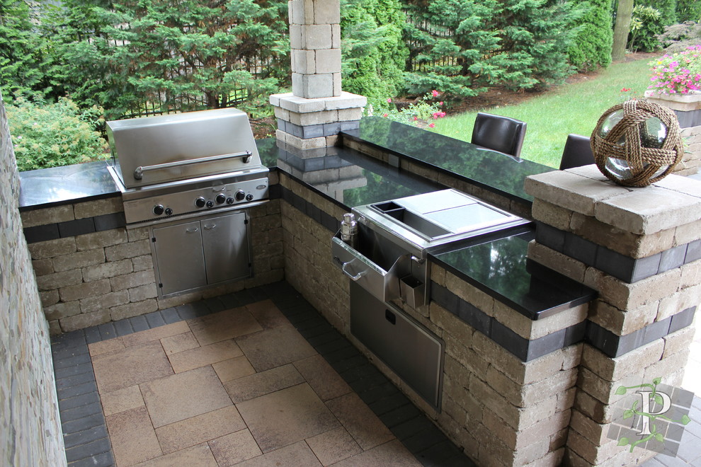 Patio kitchen - mid-sized traditional backyard concrete paver patio kitchen idea in New York