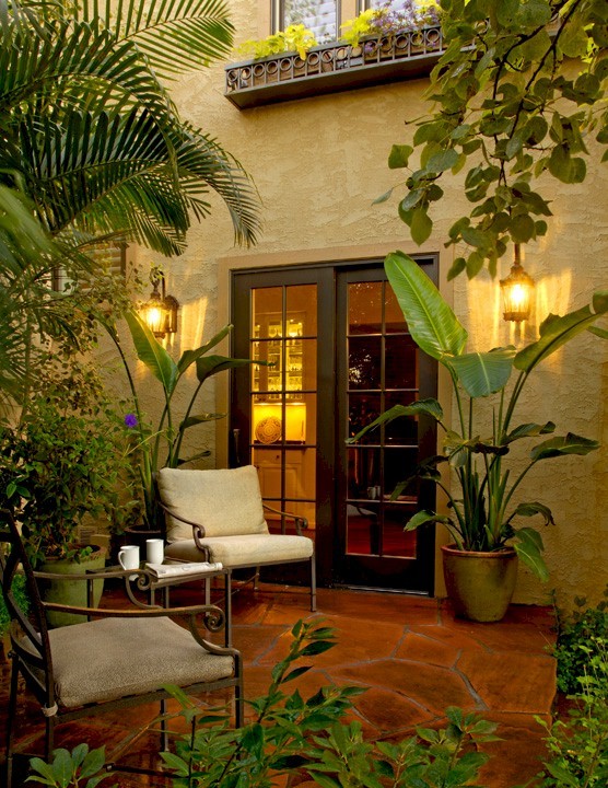 Inspiration for a medium sized traditional courtyard patio in Denver with natural stone paving and no cover.
