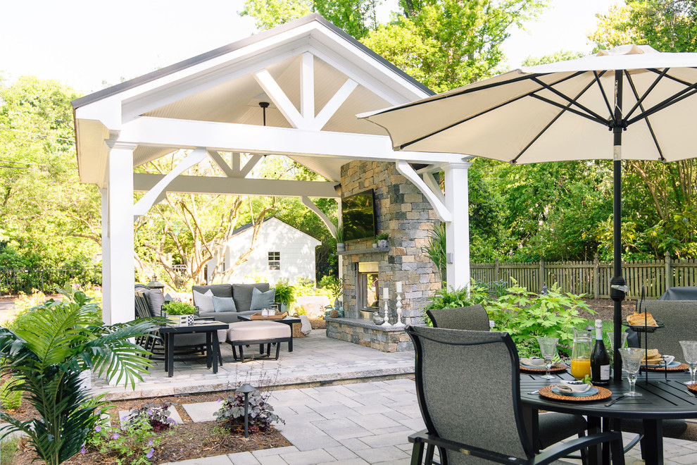 Photo of a large traditional back patio in Richmond with a fireplace, concrete paving and a gazebo.