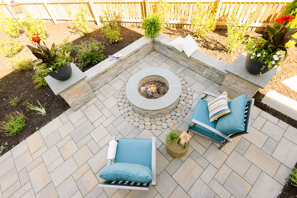 Photo of a medium sized classic back patio in Richmond with a fire feature, concrete paving and a pergola.