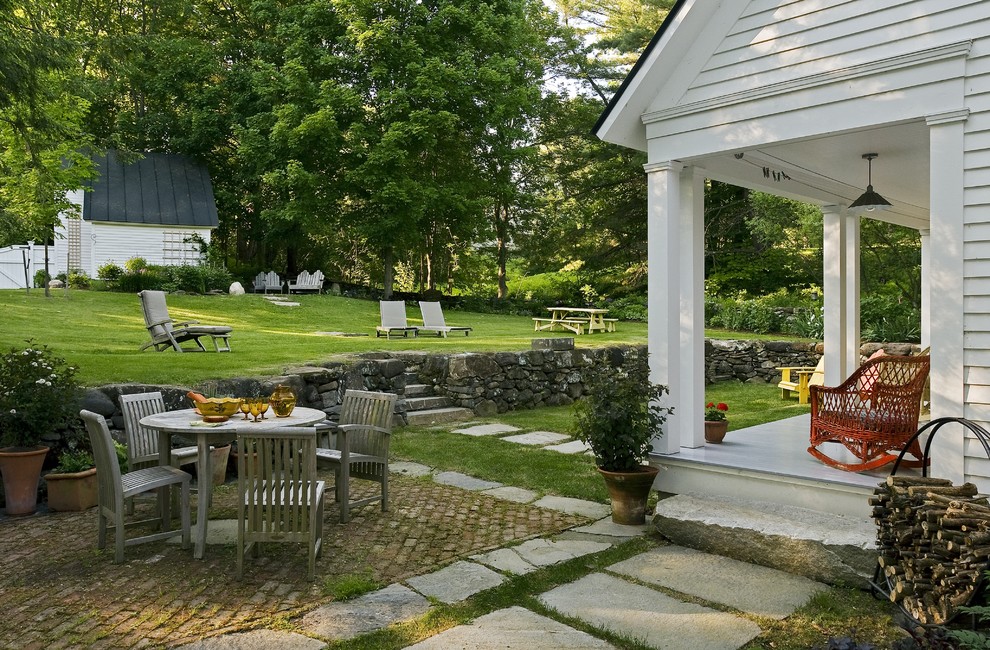 Patio - traditional brick patio idea in Burlington