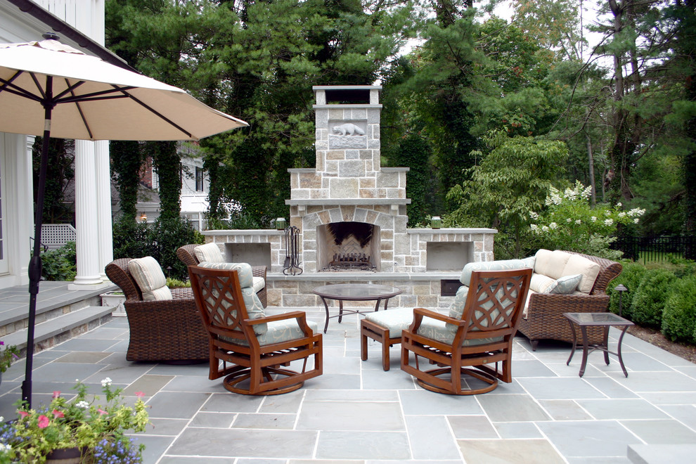 This is an example of a classic patio in New York with a fire feature.