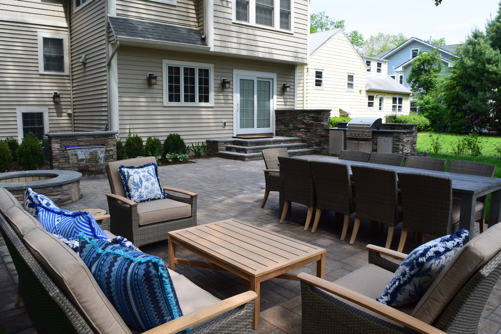Design ideas for a medium sized rustic back patio in New York with an outdoor kitchen, concrete paving and no cover.